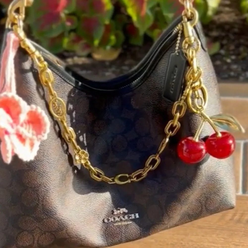 Gold C purse Chain with carriage and flowers detailing